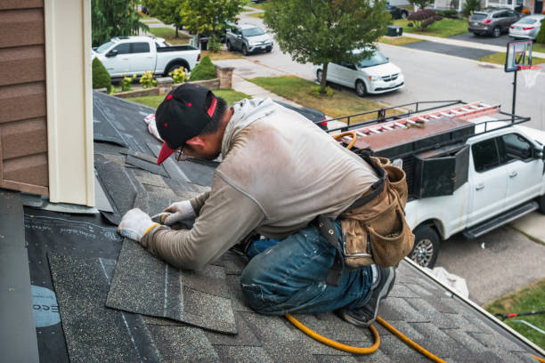 Professional Roofing technician working in Carle Place, NY
